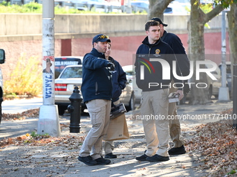 Evidence markers indicate where blood and other evidence is found after a 21-year-old man is fatally stabbed at Steuben Park in Brooklyn, Ne...