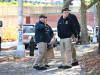 Evidence markers indicate where blood and other evidence is found after a 21-year-old man is fatally stabbed at Steuben Park in Brooklyn, Ne...