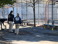 Evidence markers indicate where blood and other evidence is found after a 21-year-old man is fatally stabbed at Steuben Park in Brooklyn, Ne...