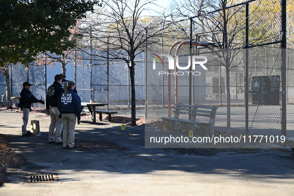 Evidence markers indicate where blood and other evidence is found after a 21-year-old man is fatally stabbed at Steuben Park in Brooklyn, Ne...