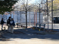 Evidence markers indicate where blood and other evidence is found after a 21-year-old man is fatally stabbed at Steuben Park in Brooklyn, Ne...