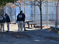 Evidence markers indicate where blood and other evidence is found after a 21-year-old man is fatally stabbed at Steuben Park in Brooklyn, Ne...