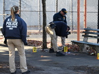 Evidence markers indicate where blood and other evidence is found after a 21-year-old man is fatally stabbed at Steuben Park in Brooklyn, Ne...