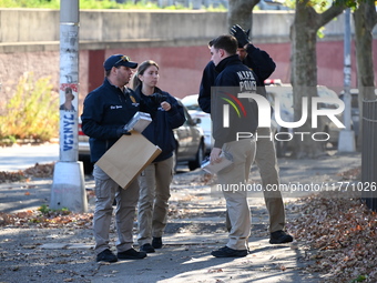 Evidence markers indicate where blood and other evidence is found after a 21-year-old man is fatally stabbed at Steuben Park in Brooklyn, Ne...