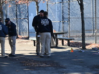 Evidence markers indicate where blood and other evidence is found after a 21-year-old man is fatally stabbed at Steuben Park in Brooklyn, Ne...