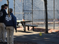 Evidence markers indicate where blood and other evidence is found after a 21-year-old man is fatally stabbed at Steuben Park in Brooklyn, Ne...