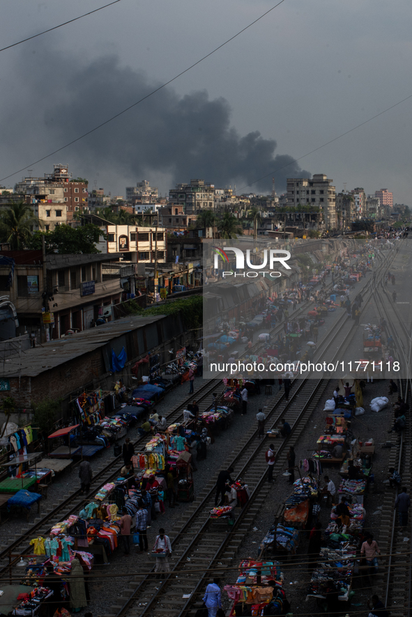 Aerial view shows smoke rising from a burning shoe factory in a densely populated residential area of Dhaka, Bangladesh, on November 12, 202...