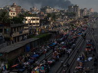 Aerial view shows smoke rising from a burning shoe factory in a densely populated residential area of Dhaka, Bangladesh, on November 12, 202...