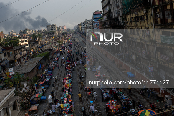 Aerial view shows smoke rising from a burning shoe factory in a densely populated residential area of Dhaka, Bangladesh, on November 12, 202...