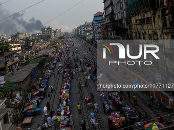 Aerial view shows smoke rising from a burning shoe factory in a densely populated residential area of Dhaka, Bangladesh, on November 12, 202...