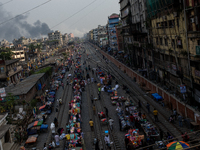 Aerial view shows smoke rising from a burning shoe factory in a densely populated residential area of Dhaka, Bangladesh, on November 12, 202...