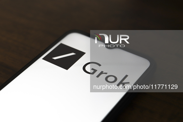 The Grok logo appears on the screen of a smartphone in Reno, United States, on November 12, 2024. Grok is a generative artificial intelligen...