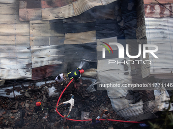 A shoe factory burns in a fire in a densely populated residential area in Dhaka, Bangladesh, on November 12, 2024. The blaze damages the fac...