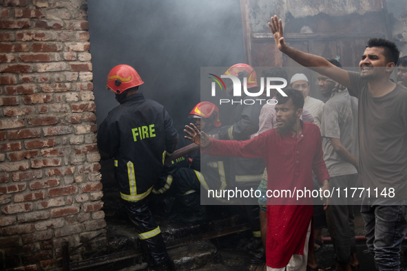 A shoe factory burns in a fire in a densely populated residential area in Dhaka, Bangladesh, on November 12, 2024. The blaze damages the fac...