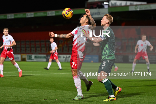 Nick Freeman (7, Stevenage) is challenged by Max Clark (3, Gillingham) during the EFL Trophy match between Stevenage and Gillingham at the L...