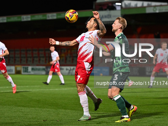 Nick Freeman (7, Stevenage) is challenged by Max Clark (3, Gillingham) during the EFL Trophy match between Stevenage and Gillingham at the L...