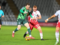 Jack Nolan (7 Gillingham) is challenged by Laurie Walker (37 Stevenage) during the EFL Trophy match between Stevenage and Gillingham at the...