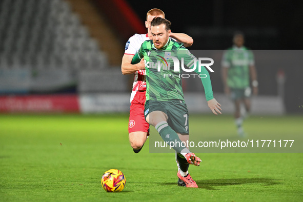 Jack Nolan (7 Gillingham) is challenged by Laurie Walker (37 Stevenage) during the EFL Trophy match between Stevenage and Gillingham at the...