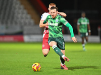 Jack Nolan (7 Gillingham) is challenged by Laurie Walker (37 Stevenage) during the EFL Trophy match between Stevenage and Gillingham at the...