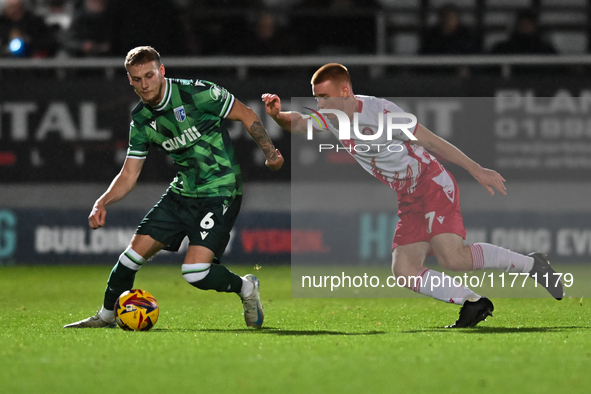 Ethan Coleman (6 Gillingham) is challenged by Nick Freeman (7 Stevenage) during the EFL Trophy match between Stevenage and Gillingham at the...