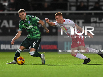 Ethan Coleman (6 Gillingham) is challenged by Nick Freeman (7 Stevenage) during the EFL Trophy match between Stevenage and Gillingham at the...