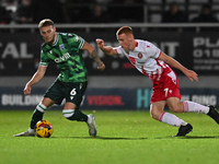 Ethan Coleman (6 Gillingham) is challenged by Nick Freeman (7 Stevenage) during the EFL Trophy match between Stevenage and Gillingham at the...