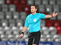 Referee Scott Simpson gestures during the EFL Trophy match between Stevenage and Gillingham at the Lamex Stadium in Stevenage, on November 1...