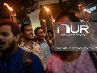 Members of the Bangladesh Students Union hold a torch procession at Dhaka University in Dhaka, Bangladesh, on November 12, 2024. The protest...