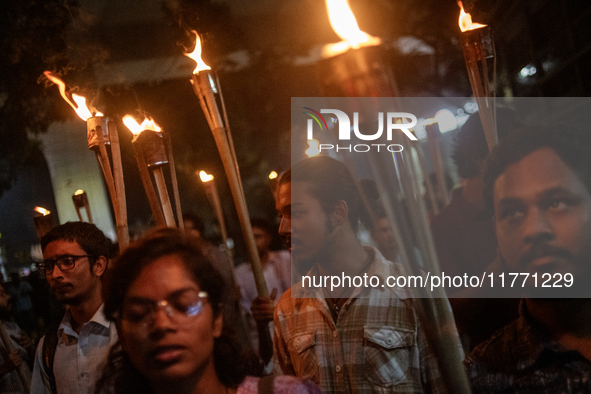 Members of the Bangladesh Students Union hold a torch procession at Dhaka University in Dhaka, Bangladesh, on November 12, 2024. The protest...