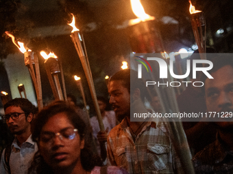 Members of the Bangladesh Students Union hold a torch procession at Dhaka University in Dhaka, Bangladesh, on November 12, 2024. The protest...