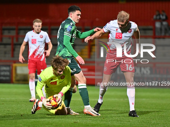 Armani Little (8 Gillingham) challenges Goalkeeper Taye Ashby Hammond (1 Stevenage) during the EFL Trophy match between Stevenage and Gillin...