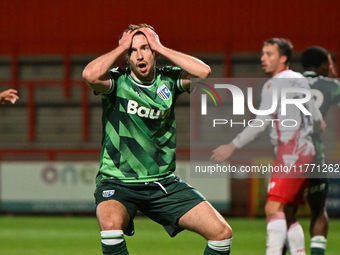 Conor Masterson (4 Gillingham) holds his head after going close during the EFL Trophy match between Stevenage and Gillingham at the Lamex St...