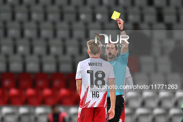 Harvey White, 18, from Stevenage, receives a yellow card during the EFL Trophy match between Stevenage and Gillingham at the Lamex Stadium i...