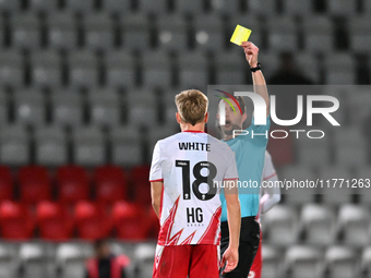 Harvey White, 18, from Stevenage, receives a yellow card during the EFL Trophy match between Stevenage and Gillingham at the Lamex Stadium i...