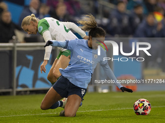 Mary Fowler #8 of Manchester City W.F.C. is tackled by the opponent during the UEFA Champions League Group D match between Manchester City a...