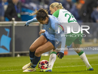 Mary Fowler #8 of Manchester City W.F.C. is tackled by Jonna Andersson #25 of Hammarby IF during the UEFA Champions League Group D match bet...