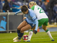 Mary Fowler #8 of Manchester City W.F.C. is tackled by Jonna Andersson #25 of Hammarby IF during the UEFA Champions League Group D match bet...