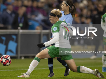 Mary Fowler #8 of Manchester City W.F.C. is tackled by the opponent during the UEFA Champions League Group D match between Manchester City a...