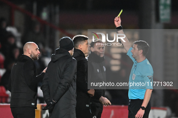 Manager Alex Revell of Stevenage receives a yellow card during the EFL Trophy match between Stevenage and Gillingham at the Lamex Stadium in...