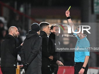 Manager Alex Revell of Stevenage receives a yellow card during the EFL Trophy match between Stevenage and Gillingham at the Lamex Stadium in...