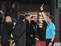 Manager Alex Revell of Stevenage receives a yellow card during the EFL Trophy match between Stevenage and Gillingham at the Lamex Stadium in...