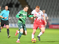 Jack Nolan (7 Gillingham) challenges Laurie Walker (37 Stevenage) during the EFL Trophy match between Stevenage and Gillingham at the Lamex...