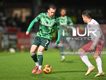 Jack Nolan (7 Gillingham) is challenged by Kane Smith (14 Stevenage) during the EFL Trophy match between Stevenage and Gillingham at the Lam...