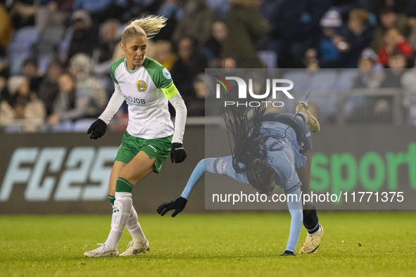 Khadija Shaw #21 of Manchester City W.F.C. is fouled by the opponent during the UEFA Champions League Group D match between Manchester City...