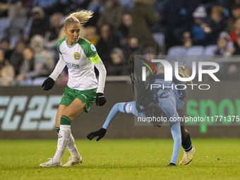 Khadija Shaw #21 of Manchester City W.F.C. is fouled by the opponent during the UEFA Champions League Group D match between Manchester City...