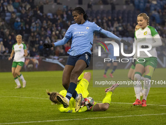 Anna Tamminen #1 (GK) of Hammarby IF makes a save from Khadija Shaw #21 of Manchester City W.F.C. during the UEFA Champions League Group D m...