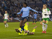 Anna Tamminen #1 (GK) of Hammarby IF makes a save from Khadija Shaw #21 of Manchester City W.F.C. during the UEFA Champions League Group D m...