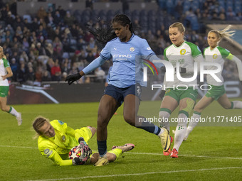 Anna Tamminen #1 (GK) of Hammarby IF makes a save from Khadija Shaw #21 of Manchester City W.F.C. during the UEFA Champions League Group D m...