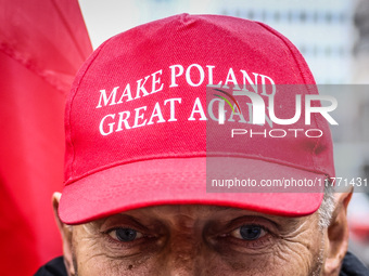 A man wears 'Make Poland Great Again' cap while attending Independence March celebrating the 106 anniversary of Poland regaining independenc...