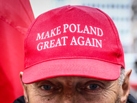 A man wears 'Make Poland Great Again' cap while attending Independence March celebrating the 106 anniversary of Poland regaining independenc...